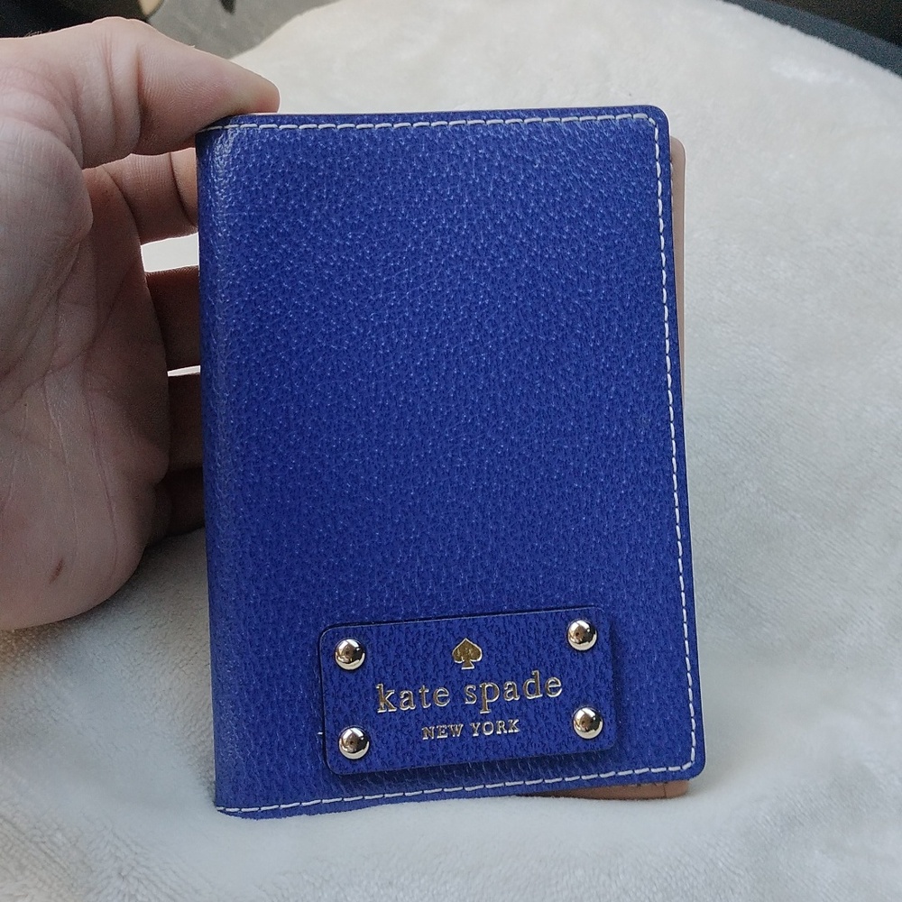 NWOT Kate Spade passport holder in blue pebbled leather.
